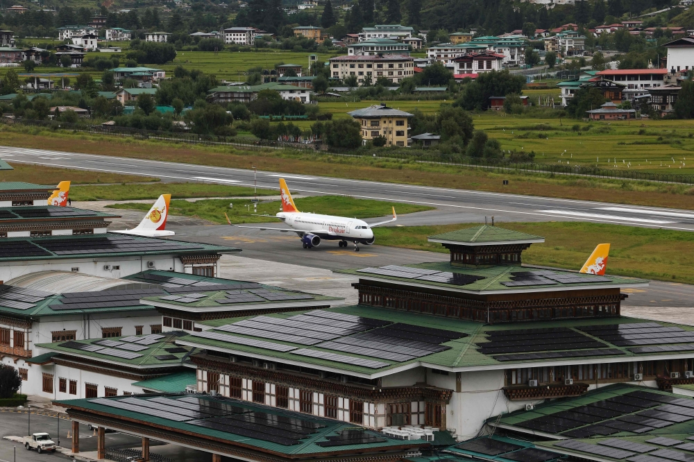 This photograph taken on September 4, 2026 shows solar panels on rooftops of buildings at Paro International Airport in Bhutan’s Paro city. — AFP pic