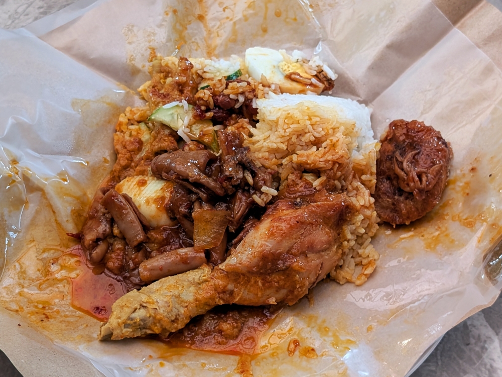 The ‘sotong sambal’ and ‘begedil’ are good, but the ‘ayam rendang’ is truly great. — Pictures by Ethan Lau