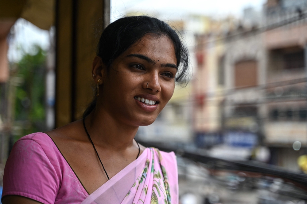 Transgender woman Bhukya Ahalya, 21, transitioned when she was 20 and struggles to update her identity documents, which still identify her as a man, making it difficult for her to get stable employment. — AFP pic
