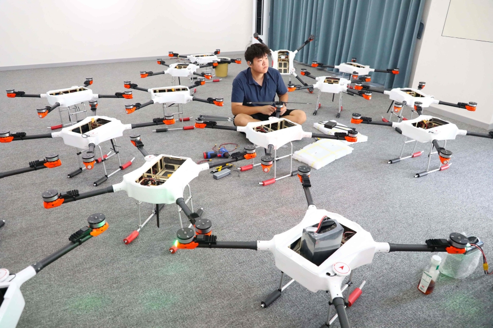 A technician assembles drones at a company in the Liangping High-tech Zone, a pilot area for developing China’s low-altitude economy, in Chongqing, southwest China, on September 8, 2026, as Beijing prepares to ban drone possession within city limits from November. — AFP pic
