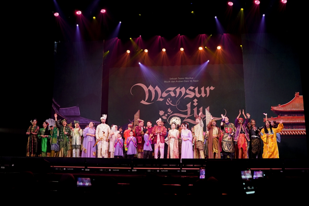 Anwar on stage alongside cast and crew of Mansur & Liu. — Picture courtesy of Icon Entertainment