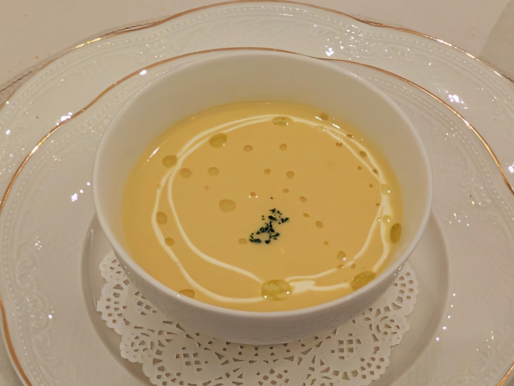  The meal starts with a clean, creamy corn soup. — Picture by Ethan Lau