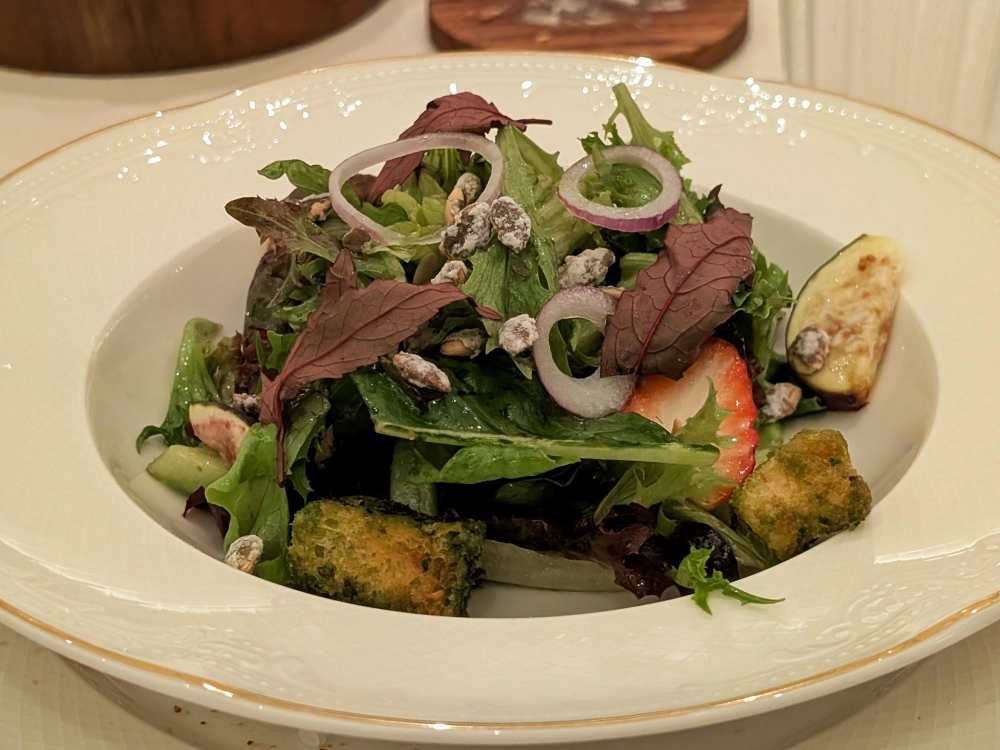 The garden salad showcases seasonal picks from Potager’s garden. At this time of year, strawberries, figs and candied pumpkin seeds were featured. — Picture by Ethan Lau