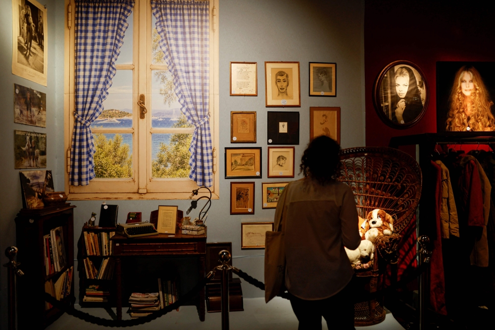 A visitor looks at items of personal belongings once owned by late French actress Brigitte Bardot displayed during a preview exhibition at Maison Drouot in Paris on September 15, 2026, ahead of an auction of her memorabilia and clothing. — AFP pic