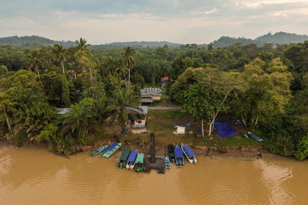 This photo taken on August 27, 2026, shows boats docked along the shore of the Kinabatangan River and surrounded with jungle in Sukau. — AFP pic 