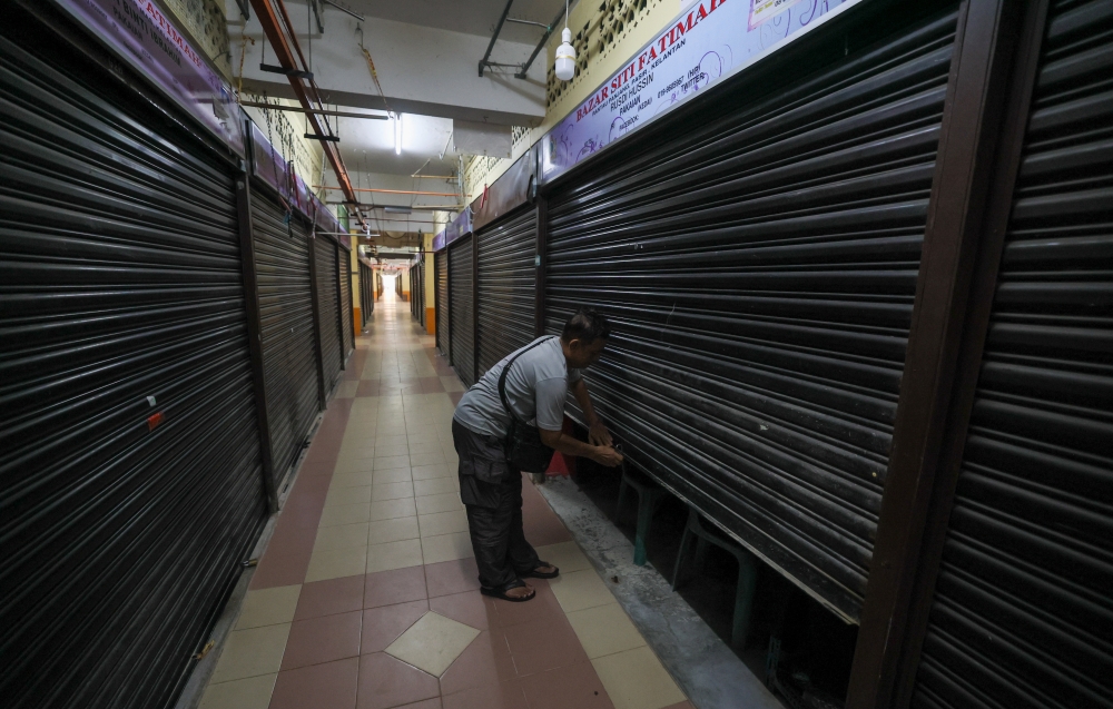 Trading activity at Bazar Siti Fatimah in Rantau Panjang remains subdued, with some stalls closed and traders struggling with dwindling customer numbers. — Bernama pic
