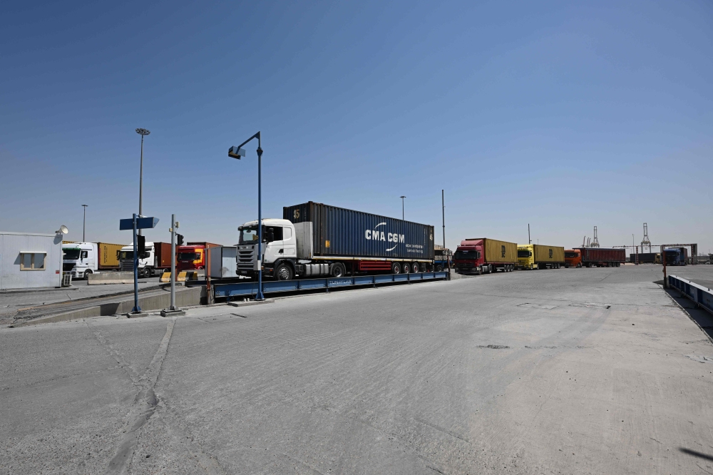 A queue of trucks waits at the weighbridge at the port of Umm Qasr in southern Iraq on September 17, 2026. — AFP pic