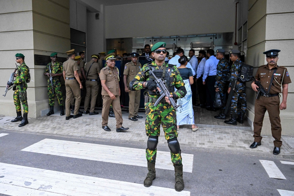 Security personnel stand guard outside Colombo High Court after escorting the accused involved in Sri Lanka’s Easter Sunday attacks of 2019, during the verdict in the trial in Colombo on September 22, 2026.
