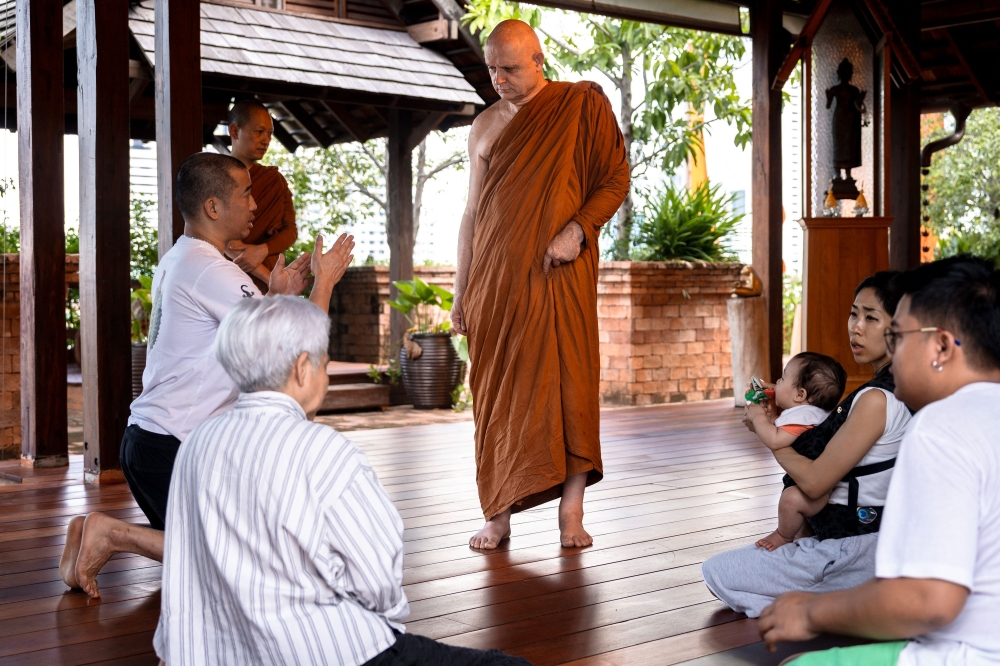 British and Thai Buddhist monk Shaun Chiverton, now known as Ajahn Jayasaro, speaks with devotees in Bangkok on September 1, 2026. From a working-class childhood on the southern English coast to the top foreign-born monk in Thailand, Chiverton's quest for a better life has taken him further than most. Five decades after he travelled to India to follow the Buddha's teachings, the 68-year-old this summer became the first non-Thai to be elevated to rank of Somdet Phra Rachakhana, or royal monastic leader -- the second-highest level in Thailand's monkhood. — AFP pic