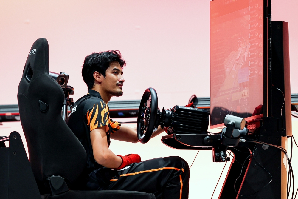 National esports athlete Taj Izrin Aiman Taj Madira competes in the Gran Turismo 7 event that delivered Malaysia its second gold medal at the Aichi-Nagoya 2026 Asian Games at Aichi Sky Expo on September 23, 2026. — Bernama pic