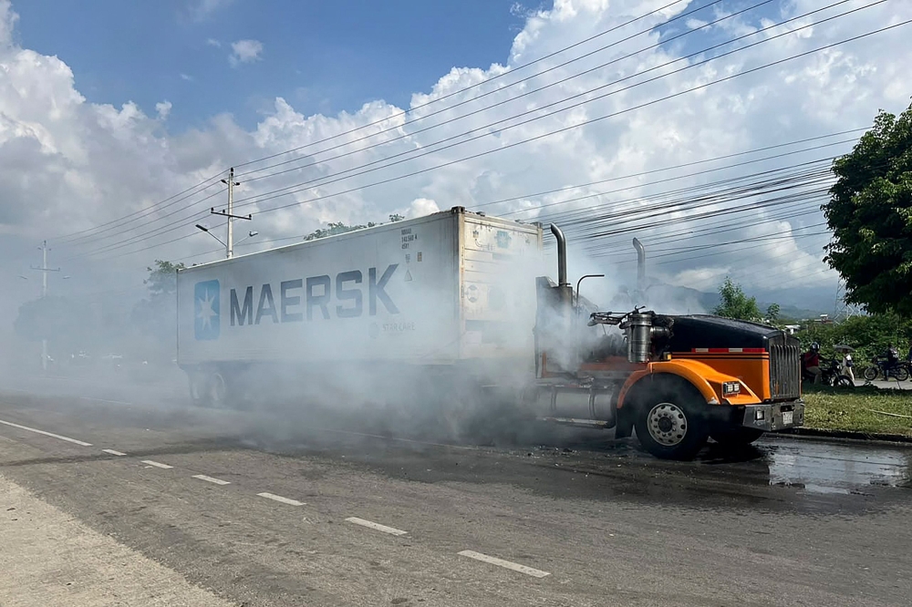 A burnt truck is seen on a road in the wake of a military operation by the Colombian Army against the drug-related armed group Conquering Self Defense Forces of the Sierra Nevada (ACSN) in Santa Marta, Colombia on September 22, 2026. — AFP pic