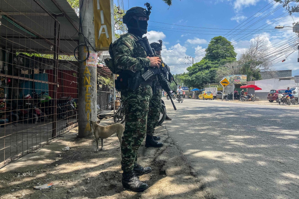 Colombian soldiers stand guard on a street following a military operation against the drug-related armed group Conquering Self Defense Forces of the Sierra Nevada (ACSN) in Santa Marta, Colombia on September 23, 2026. — AFP pic