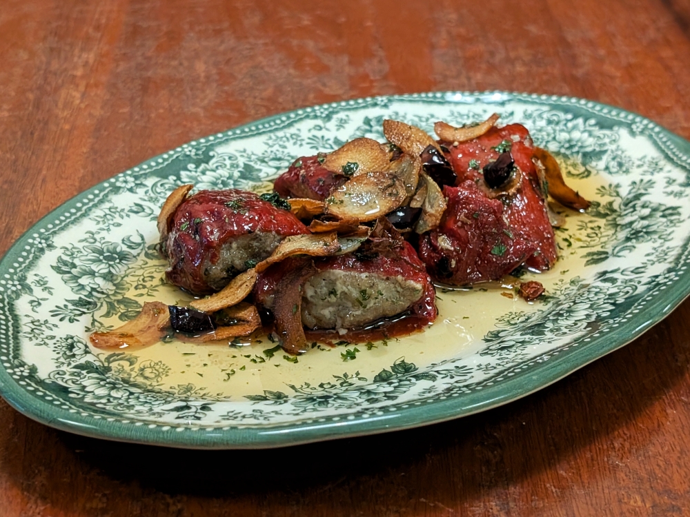 A tapas classic of stuffed piquillo peppers gets a sweet dunk of Sauternes, a French dessert wine. — Picture by Ethan Lau