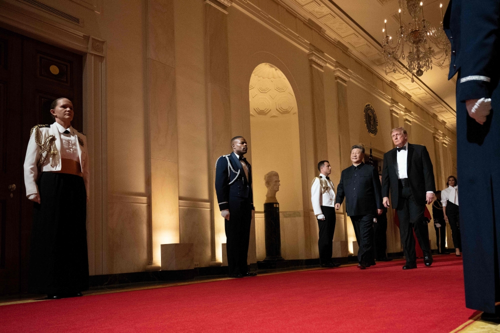 US President Donald Trump and China’s President Xi Jinping arrive for a State Dinner in the East Room of the White House in Washington, DC, on September 24, 2026. — AFP pic
