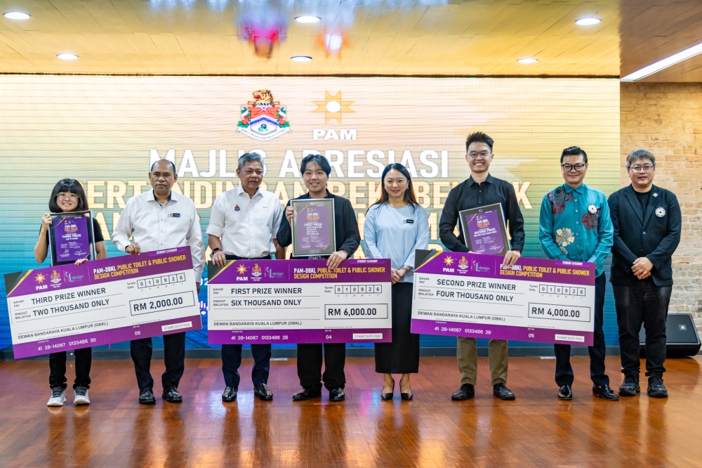 Federal Territories Minister Hannah Yeoh poses with winners of the student category at the Kuala Lumpur public toilet and shower design competition on September 25, 2026. — Picture by Firdaus Latif