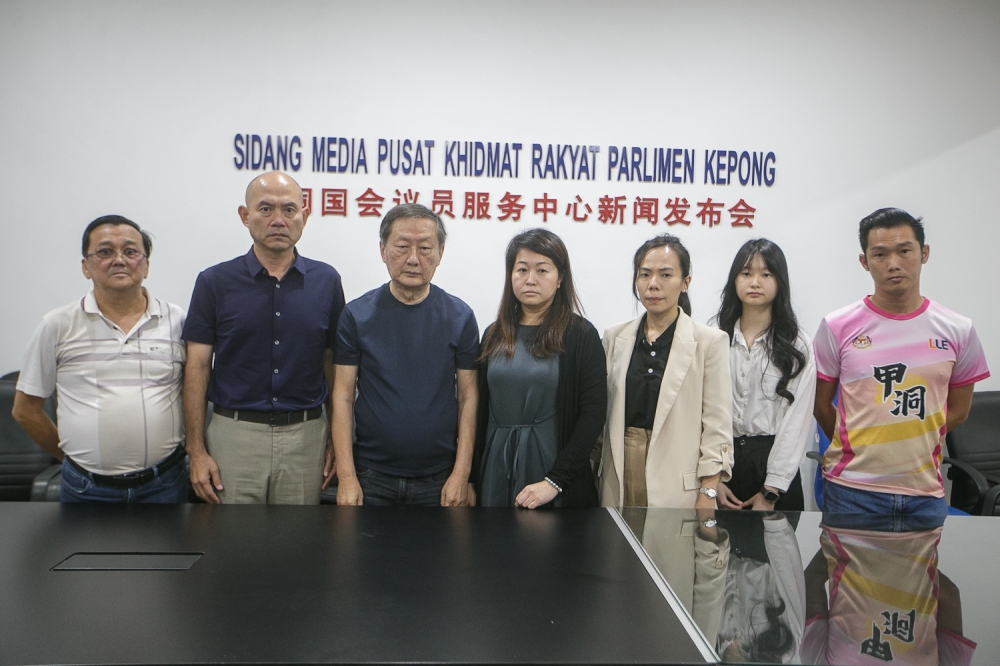Wong Lee Ping and How Boon Chin, the parents of 16-year-old student Yap Shing Xuen, who was fatally stabbed at a Bandar Utama school last year, stand alongside Kepong MP Lim Lip Eng (2nd left) and supporters during a press conference at the Kepong MP Service Centre in Kuala Lumpur on September 25, 2026. — Picture by Raymond Manuel