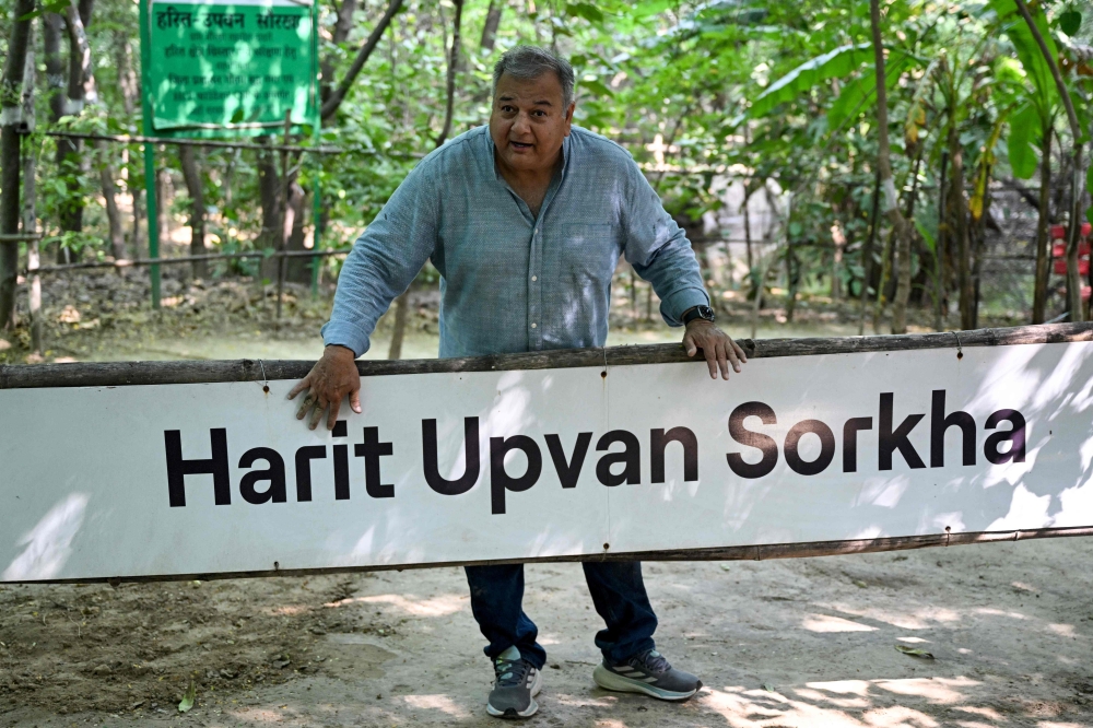 This photograph taken on September 16, 2026 shows environmentalist Swami Prem Parivartan, better known as ‘Peepal Baba’, speaking during a visit to the urban forest ‘Harit Upvan’ in Sorkha village, Noida. — AFP pic