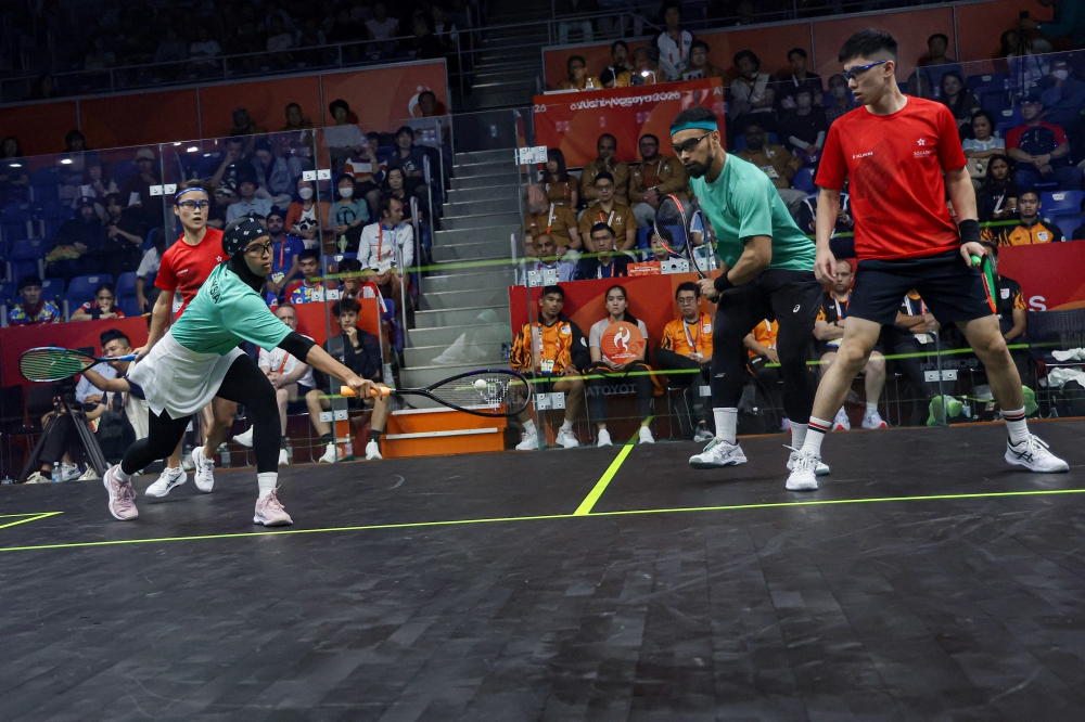 Malaysian pair Mohammad Syafiq Kamal and Aifa Azman in action against Hong Kong’s Lee Ka Yi–Tang Ming Hong during the mixed doubles squash quarter‑finals at the Aichi‑Nagoya 2026 Asian Games at the Nagoya Kinjo Futo Arena September 25, 2026. — Bernama pic