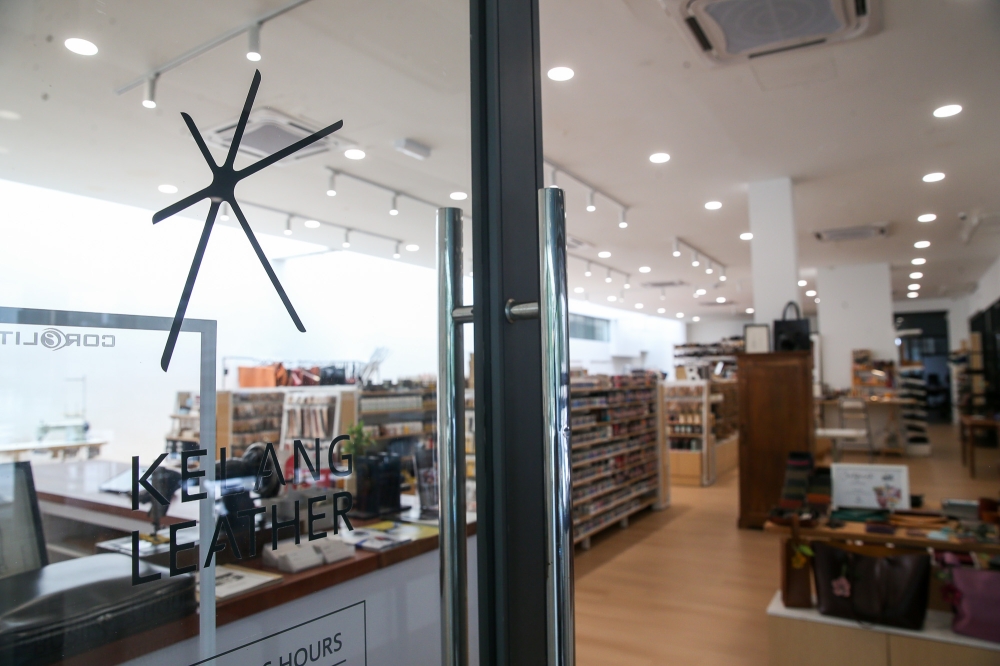 Seen here at its former Zebra Square outlet is Kelang Leather's new logo designed by Alec, featuring six spokes forming the letter 'K' which represents all six family members including his late mother Daisy Goh who handled payroll and two other siblings not involved in the business. — Picture by Choo Choy May