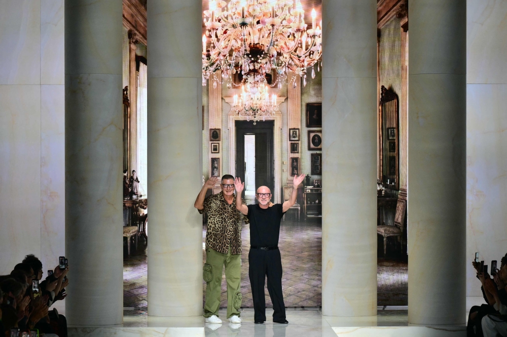 Italian designer Stefano Gabbana and Italian fashion designer Domenico Dolce greet the audience at the end of the Dolce & Gabbana collection show as part of Women’s Spring/Summer 2027 Milan’s fashion week September 26, 2026. — AFP pic