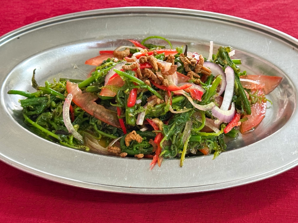 ​​​​​​​Refreshing, crunchy Stir Fried Paku Pakis is topped with tiny deep fried baby prawns. — Picture by Lee Khang Yi