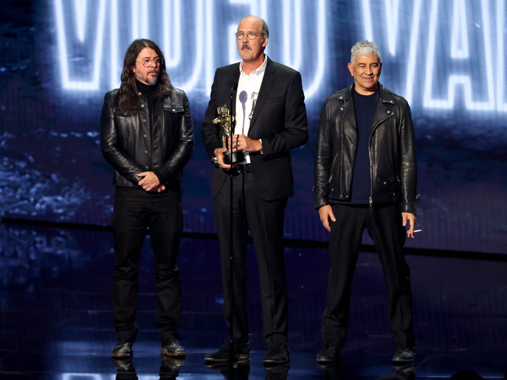 (From left) Dave Grohl, Krist Novoselic, and Pat Smear of Nirvana accept the Video Vanguard Award onstage during the 2026 MTV Video Music Awards (VMAs) at Peacock Theater in Los Angeles, California September 27, 2026. — Kevin Winter/Getty Images North America/Getty Images pic via AFP