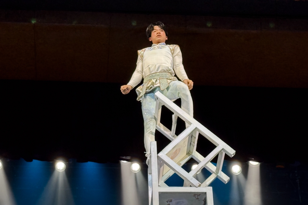 Watching Sha Ma Laqian perform stunts atop a stack of chairs reaching up to 10 metres, it may seem effortless for him, but the feat is the culmination of 12 years of training that began in childhood. — Bernama pic 