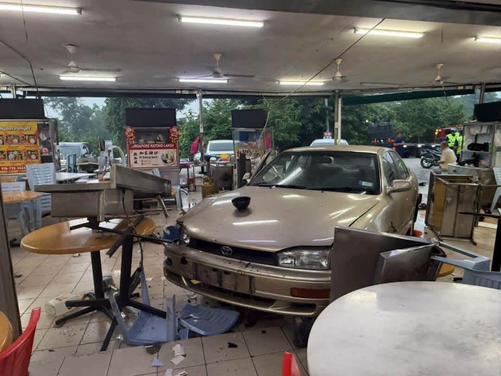 The aftermath of an accident at an eatery in Taman Daya, Johor Bahru, after a Toyota Camry crashed into two vehicles before ploughing into the premises on September 29, 2026. — Screengrab via Facebook/Bikram Nisturi