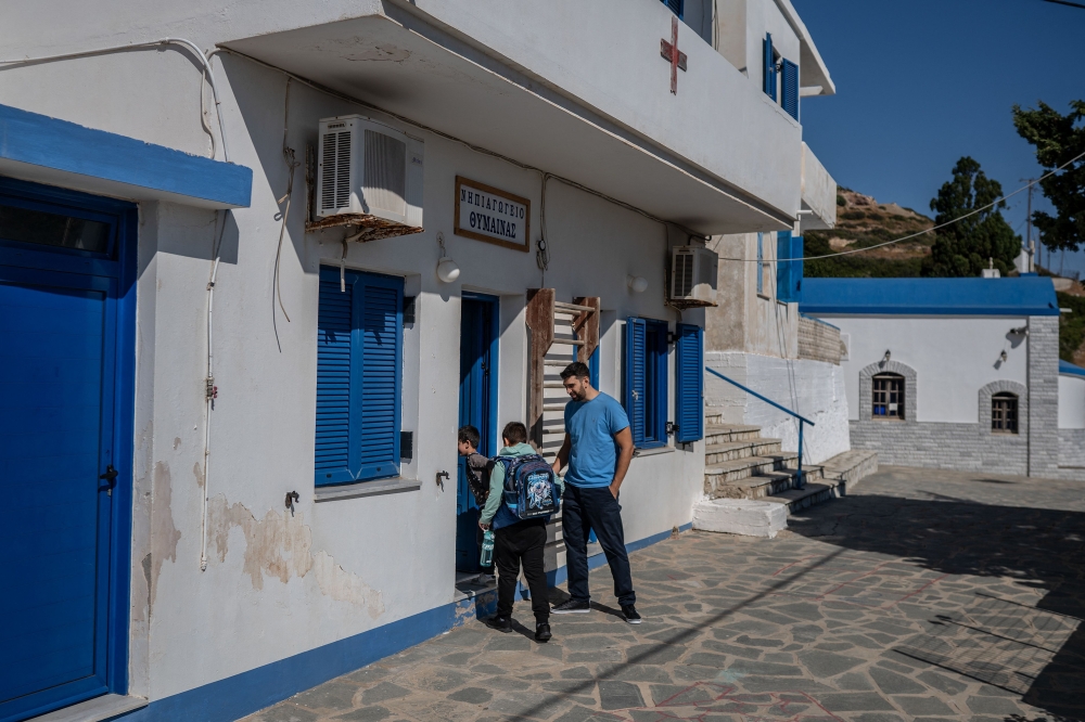 Minas and Giorgos, the only two primary school students on Thymaina. — AFP pic