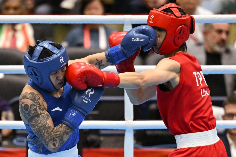 Taiwan’s Lin Yu-ting (red) competes against China’s Yang Chengyu in the women’s 60kg gold medal boxing bout during the 2026 Asian Games at Nishio Gymnasium in Nishio on October 2, 2026. — AFP pic