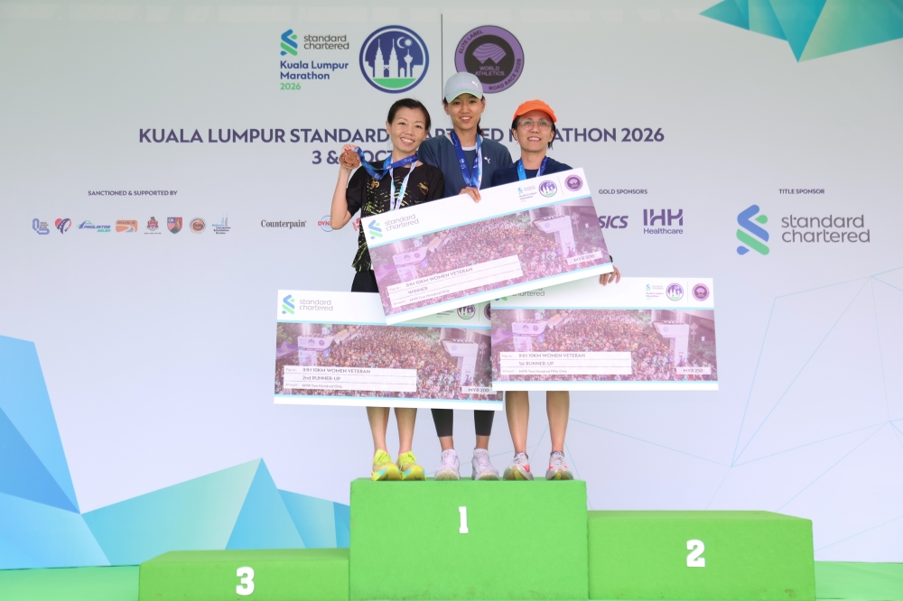 Malaysia’s Chua Mei Yin (centre), Foo Yin Yin and Lim Pei Ting pose after sweeping the podium in the IHH 10km Women’s Veteran category at the Kuala Lumpur Standard Chartered Marathon 2026 in Kuala Lumpur October 3, 2026. — Picture courtesy of KLSCM