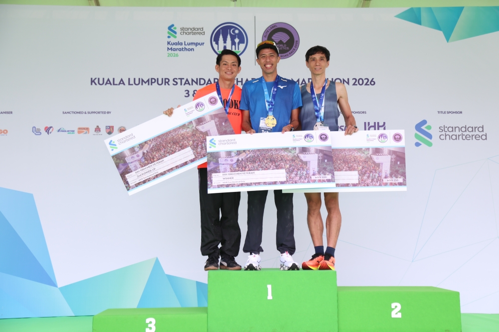 Malaysia’s Lee Ching Keong, Singapore’s Marcus Ong (centre) and Malaysia’s Yong Khong Wei pose after finishing second, first and third respectively in the IHH 10km Men’s Veteran category at the Kuala Lumpur Standard Chartered Marathon 2026 in Kuala Lumpur October 3, 2026. — Picture courtesy of KLSCM