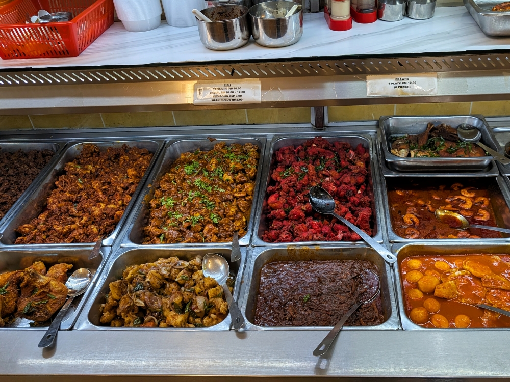 The non-vegetarian selection spans egg, chicken, mutton and even fish too. — Picture by Ethan Lau