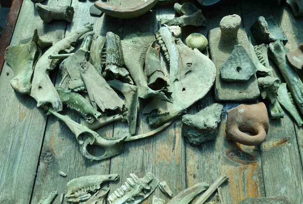 A photograph shows artefacts discovered by the expedition members at the underwater site on the bed of Lake Issyk-Kul of what is identified by researchers as a submerged medieval city on the Silk Road in the settlement of Toru-Aygyr in Kyrgyzstan on September 22, 2026. Situated on an ancient trading route between China and Europe, little is known about the history of the settlement under Kyrgyzstan's largest lake or how it came to be flooded an estimated 800 years ago. The settlement is located at the heart of what was once the Silk Road, a trading route that linked China to the Mediterranean from the 2nd century BC until the mid-15th century. — AFP pic