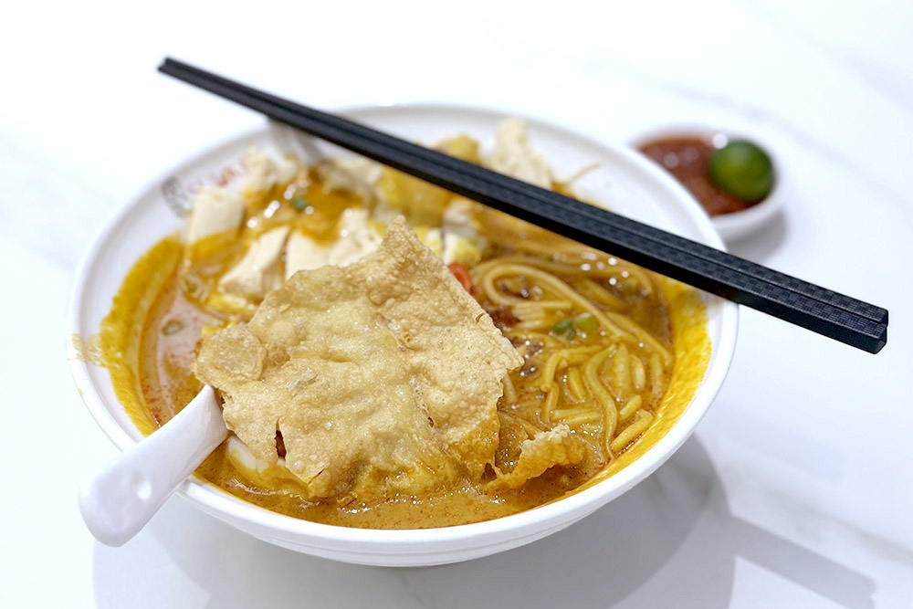 Nyonya 'laksa' with Hainanese 'kampung' chicken. — Picture by CK Lim