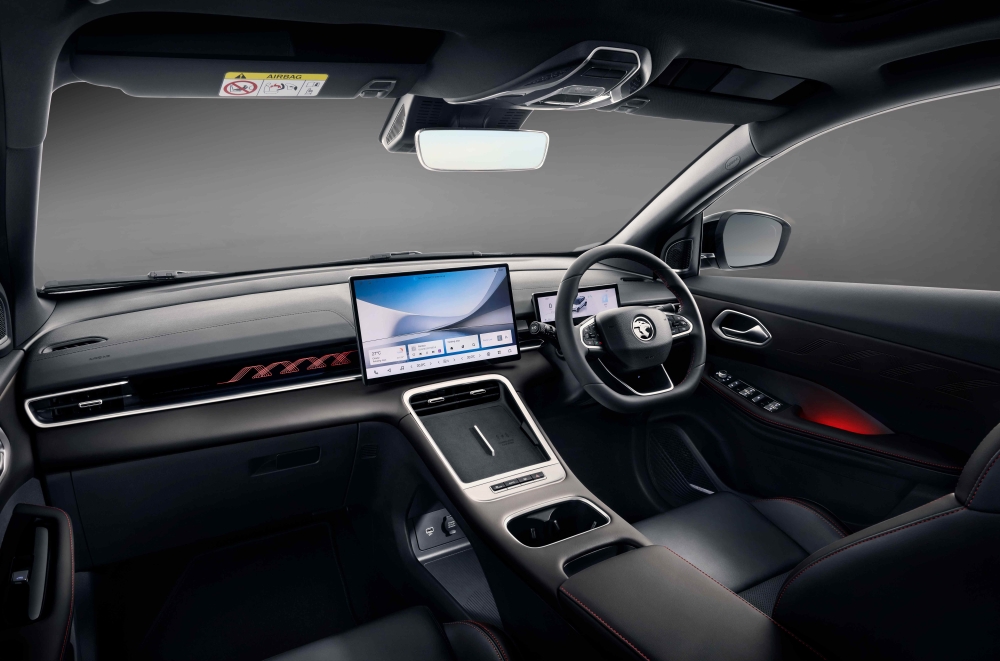 Black cabin with red stitching on the steering wheel and seats, Sport Edition embroidery on the front seats and TPE floor mats. — Picture courtesy of Proton