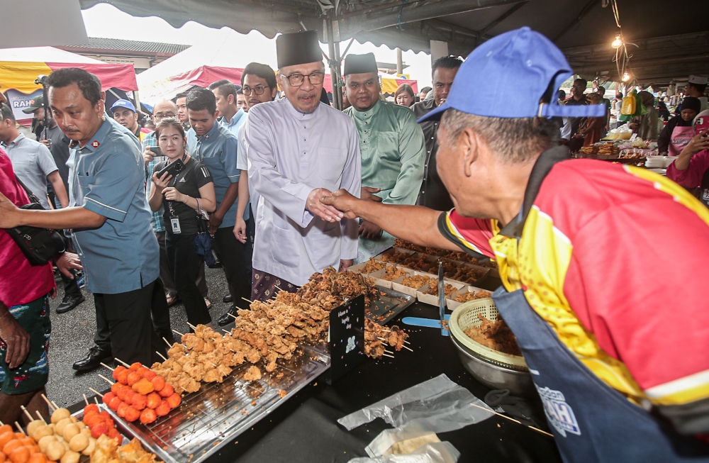 Anwar has also signalled the possibility of higher allocations for small traders and entrepreneurs under Budget 2027. — File picture by Farhan Najib