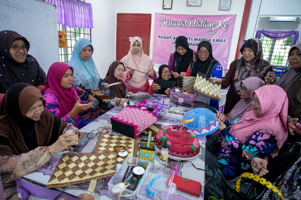 Participants at the activity centre in Manong. — Bernama pic