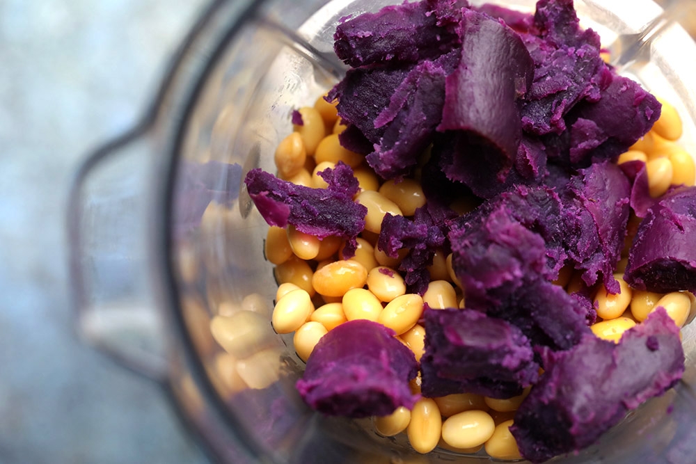 Blend the steamed sweet potatoes and soaked soybeans together. — Picture by CK Lim