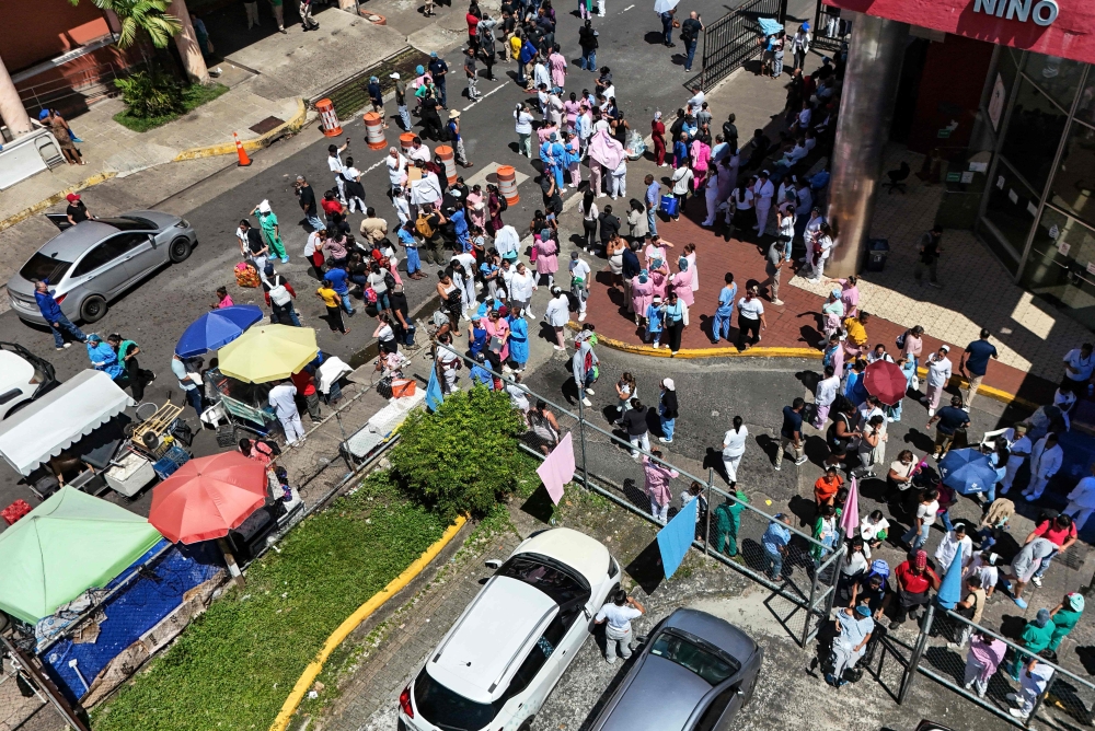 This aerial view shows people being evacuated at the Hospital del Nino after a severe 7.6 magnitude earthquake hit the country, in Panama City October 9, 2026. — AFP pic