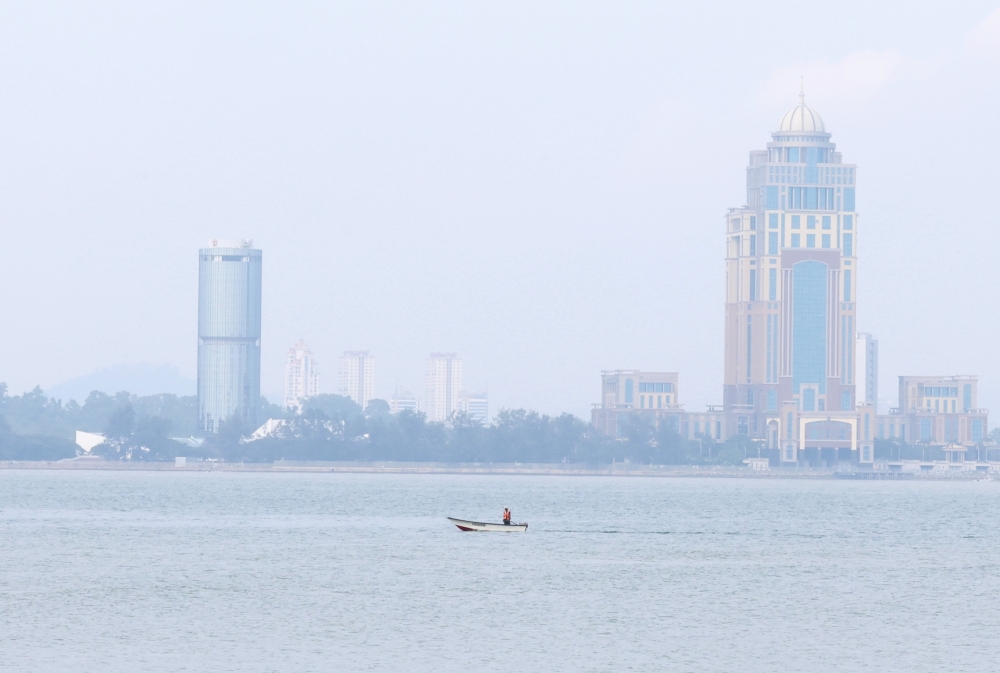 A view of the Tun Mustapha Tower and Kinabalu Tower as haze continued to blanket Kota Kinabalu’s skies October 9, 2026. South-east Asia has lived with transboundary haze for far too long. — Bernama pic