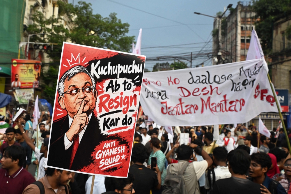 Student activists aligned with left-wing organisations hold a poster of India’s Chief Election Commissioner Gyanesh Kumar during a protest in solidarity with the youth-led Cockroach Janata Party (CJP) over alleged voter roll irregularities in Kolkata, India, on October 11, 2026. — AFP pic