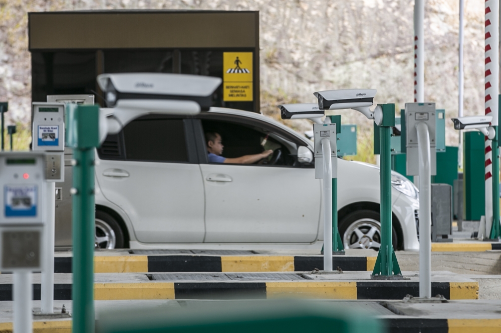 In normal operation, the process is simple: drive into a participating lane, the camera reads the number plate, the system matches the vehicle to the registered account and the toll is charged to the linked bank card. — Picture by Hari Anggara