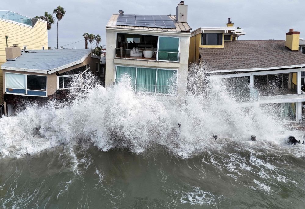 An aerial view shows Pacific Ocean waves crashing into damaged homes amid high surf generated by Tropical Storm Rachel in Long Beach, California, on October 11, 2026. — AFP pic