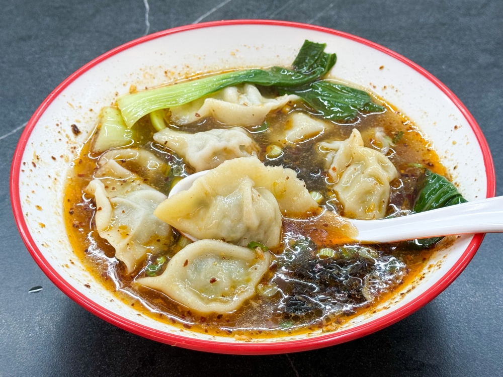 Dumplings in Sour Soup is an appetising way to enjoy boiled dumplings filled with pork and vegetables — Picture by Lee Khang Yi