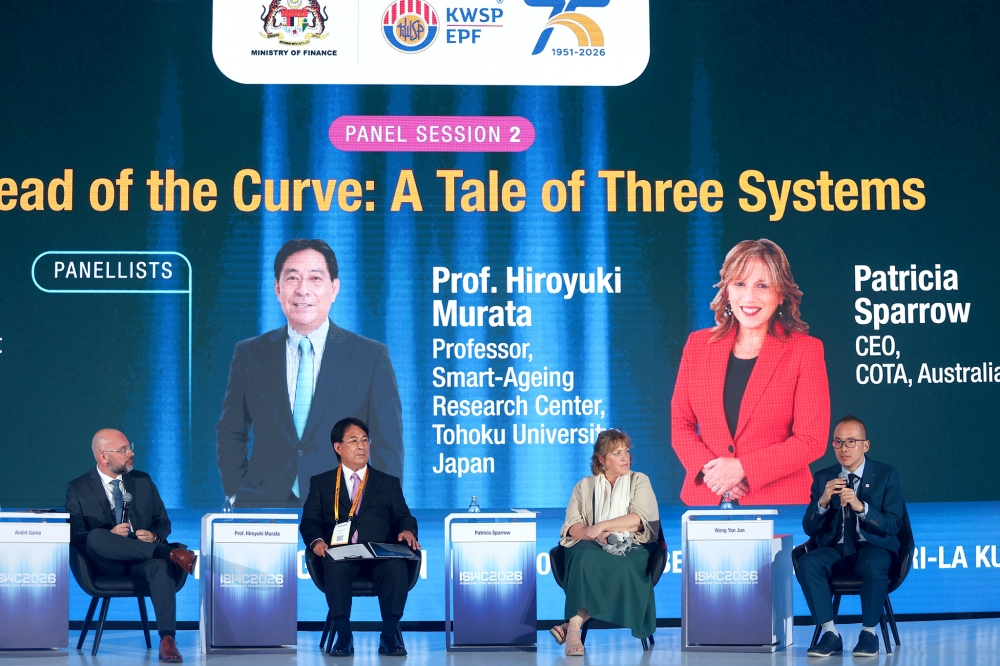 ILO Regional Social Protection Specialist for South-East Asia and the Pacific André Gama (first one from the left) said younger and older workers can complement each other’s strengths when working together. — Picture by Firdaus Latif