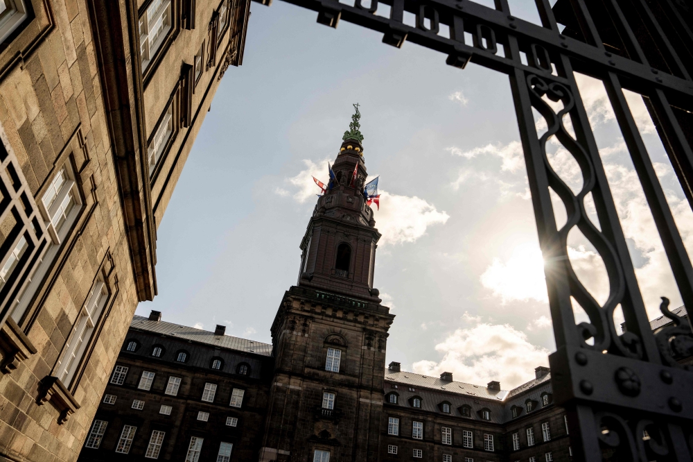 In this file photo taken on June 3, 2025 the flags of Denmark and the European Union fly on the Danish Parliament Christiansborg in Copenhagen, Denmark. — KMads Claus Rasmussen/Ritzau Scanpix/AFP PIC