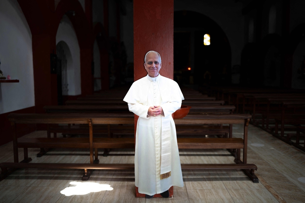 A cardboard cutout of Pope Leo XIV is displayed inside the main church in Saٌa, in the Lambayeque region of northern Peru, on October 13, 2026. Pope Leo XIV had a cancerous tumour surgically removed from his right lung on October 13, in a 90-minute operation described as ‘successful’ by the Vatican. — AFP pic