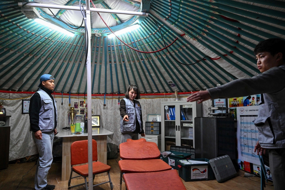 Members of the Misheel Kids Foundation (MKF) prepare a mobile dental clinic inside a traditional Mongolian ger in Ulaanbaatar. — AFP pic