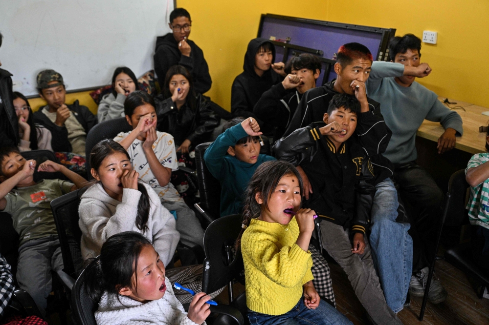Children learn about oral hygiene in Ulaanbaatar. — AFP pic